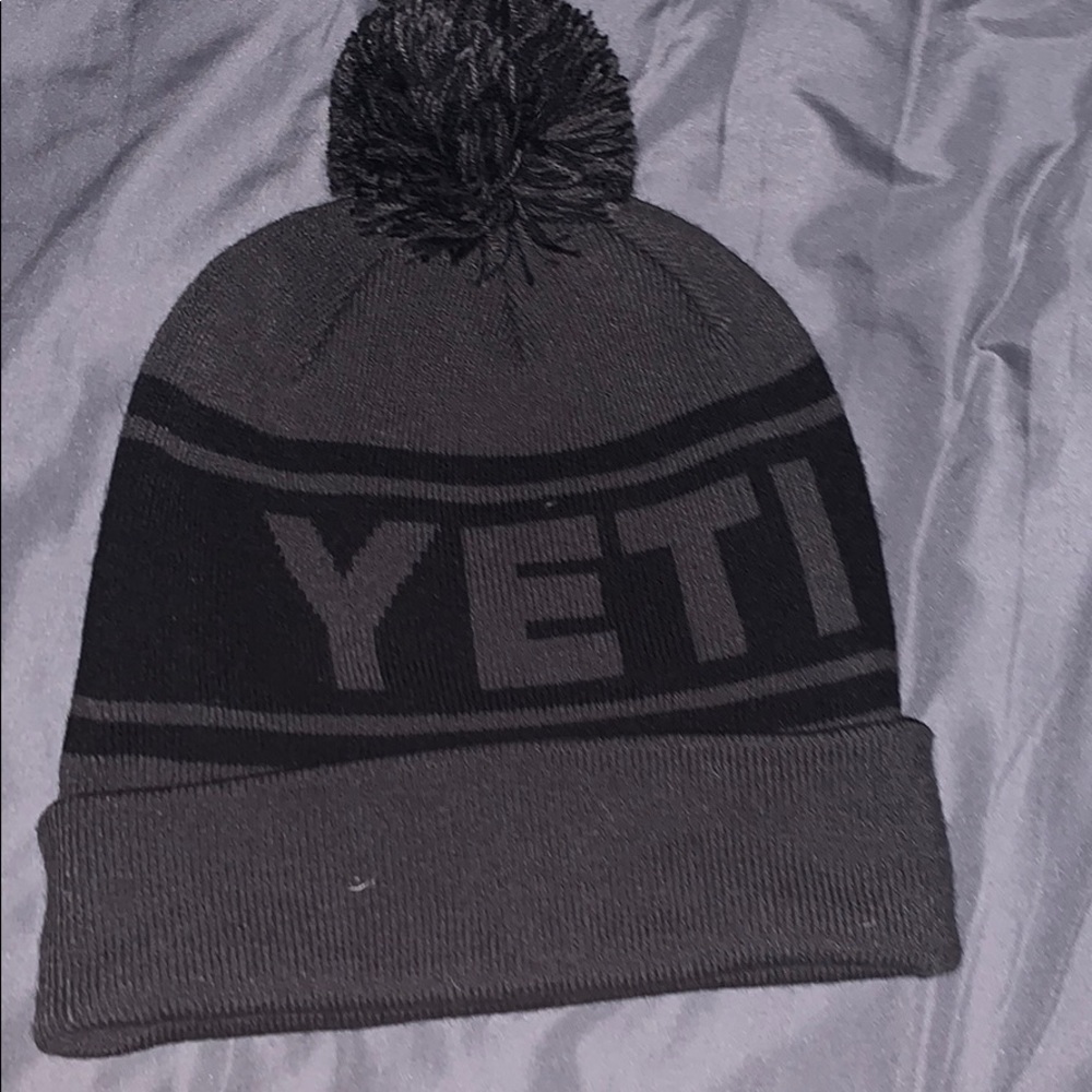 A black and grey Yeti beanie
